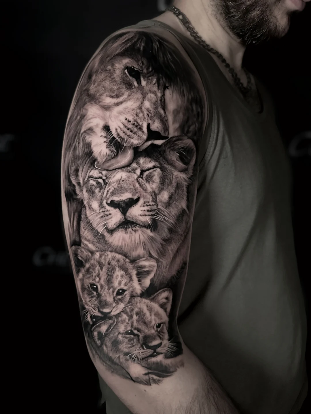 Realistic black and grey lion tattoo sleeve