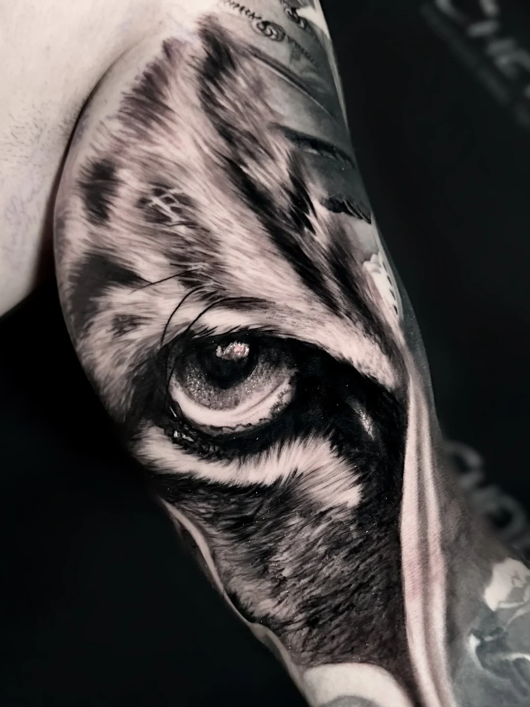 Hyper-realistic tiger eye tattoo