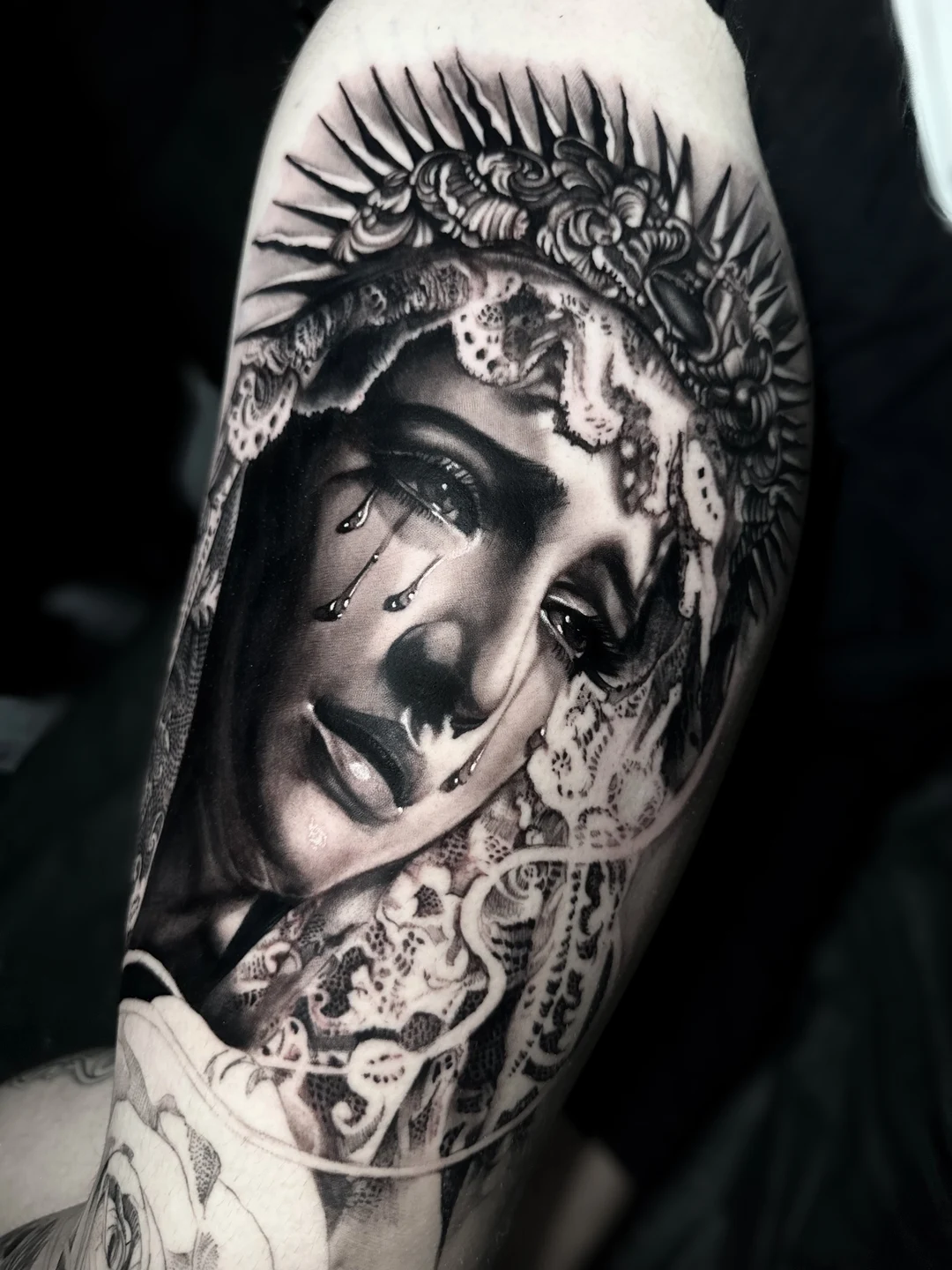 Black and grey realism saint portrait tattoo