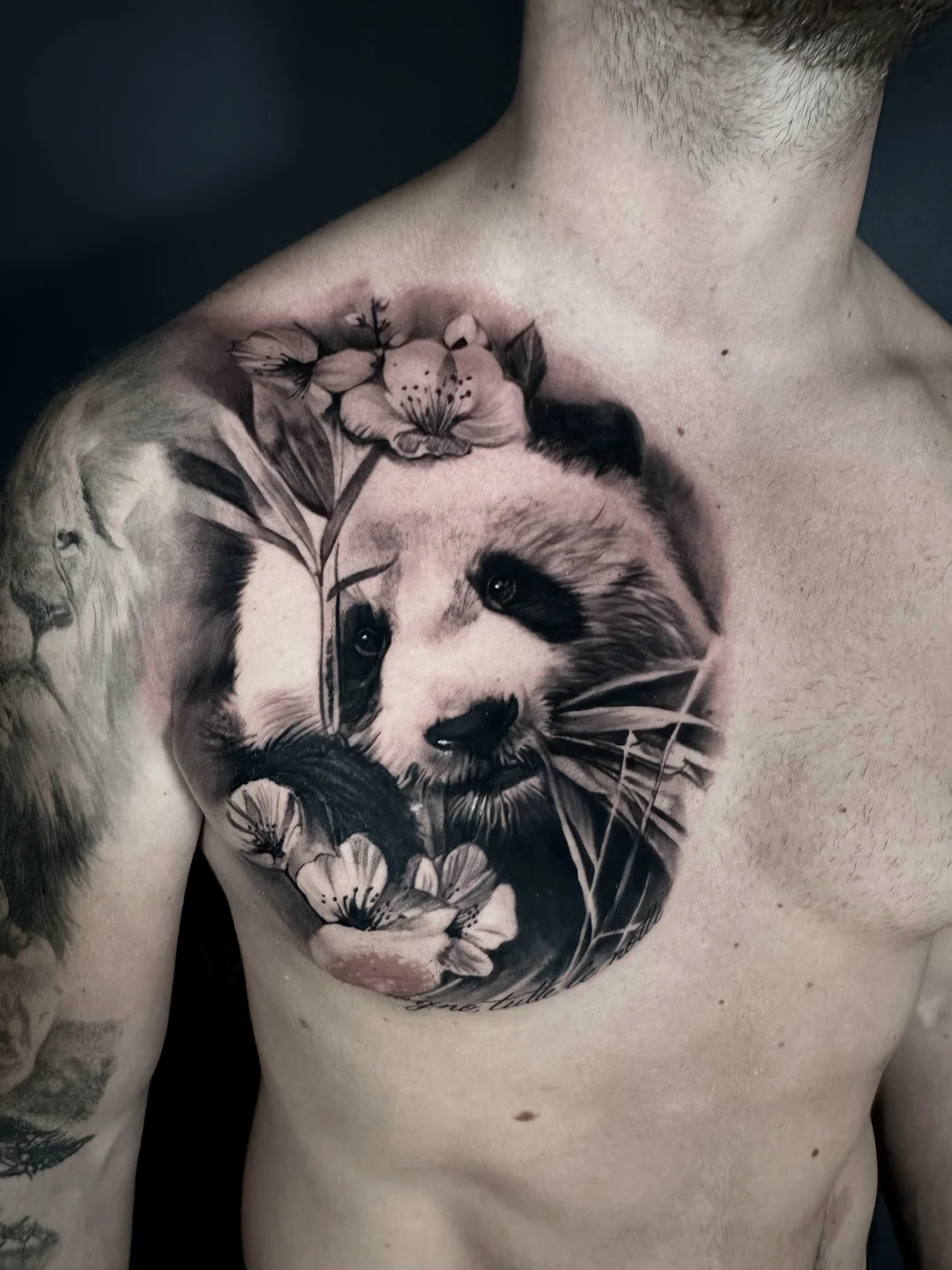 Black and grey realism chest portrait tattoo