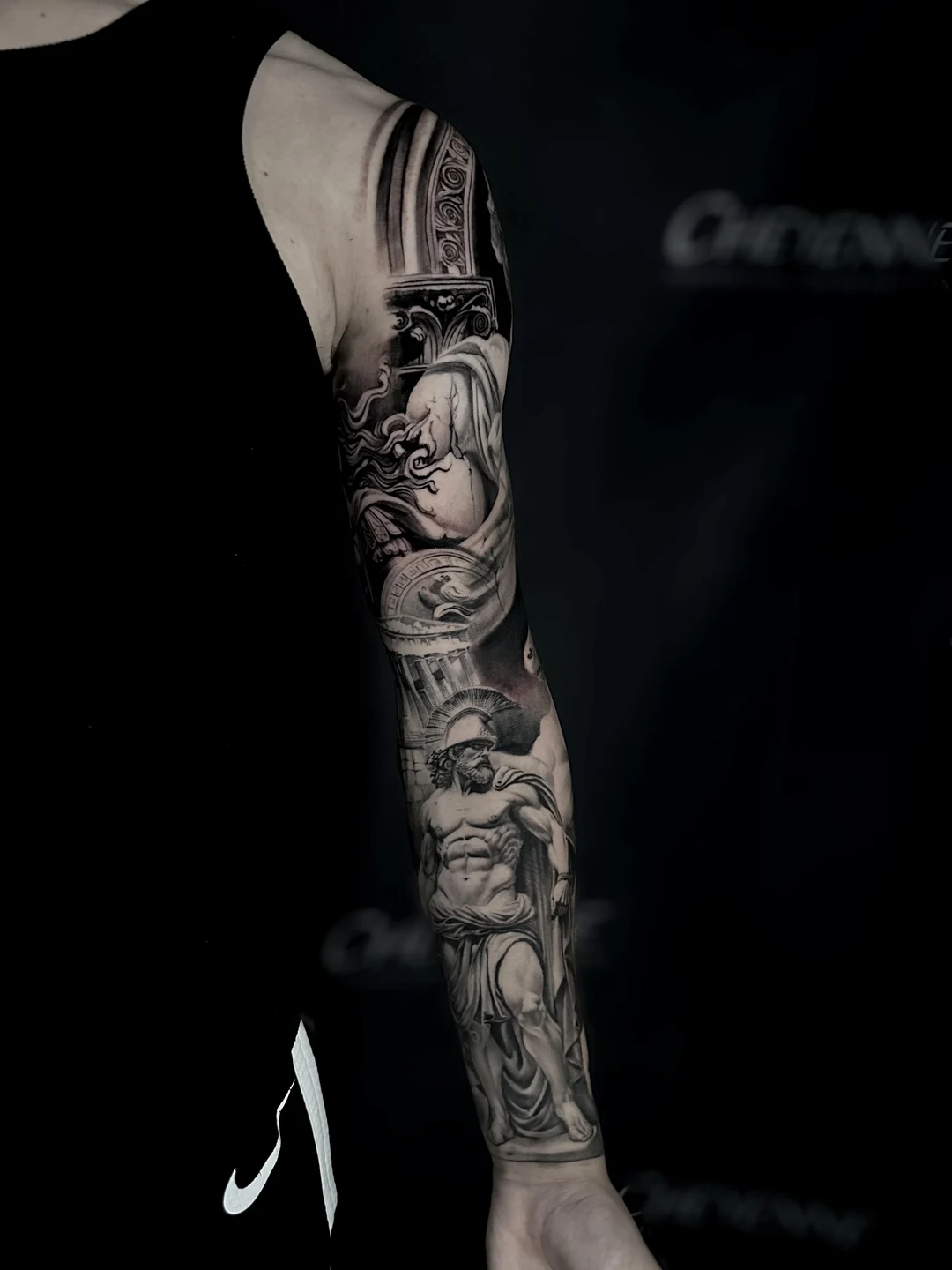 Realistic statue full sleeve tattoo, front view