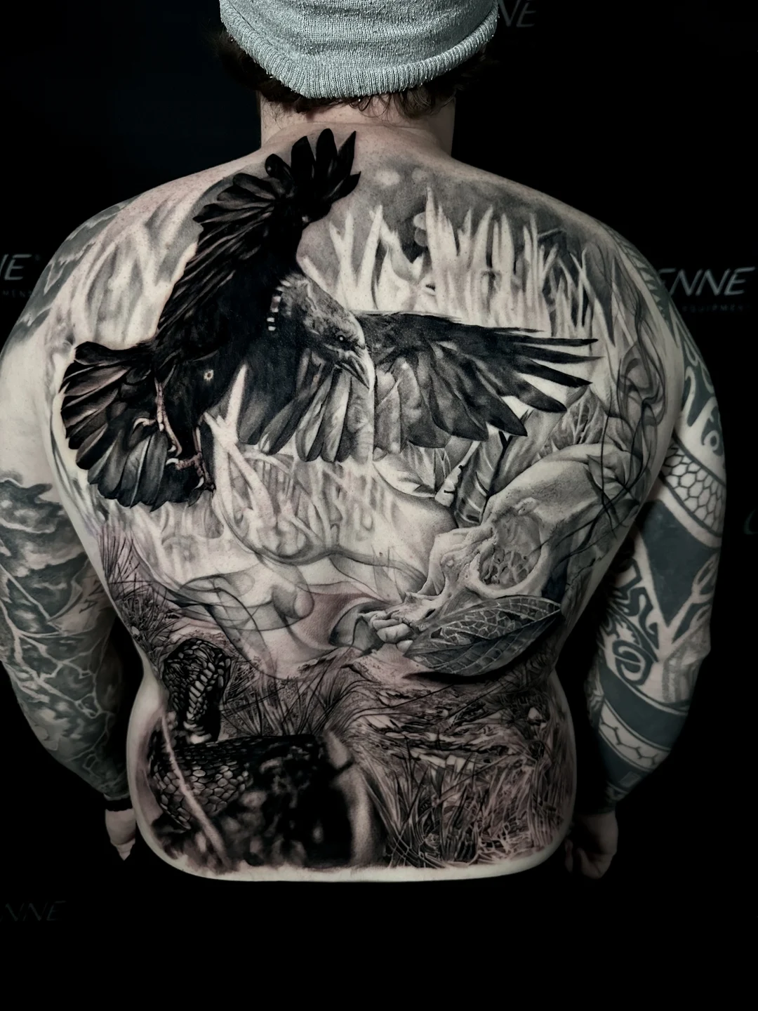 Large-scale realistic back piece tattoo