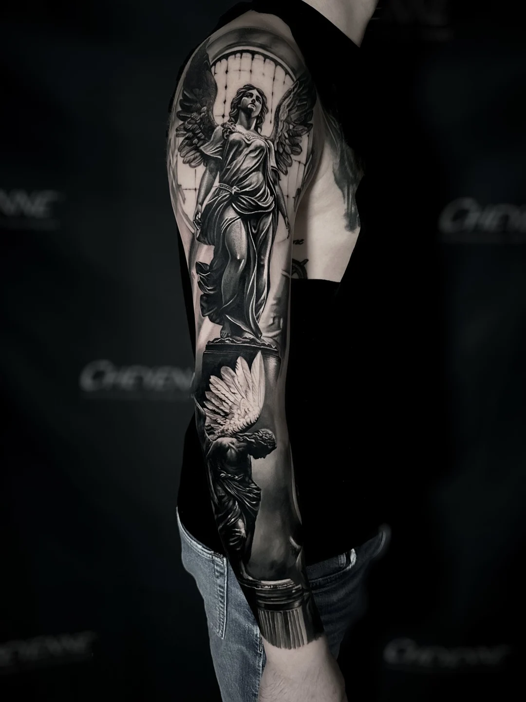 Realistic black and grey sleeve tattoo
