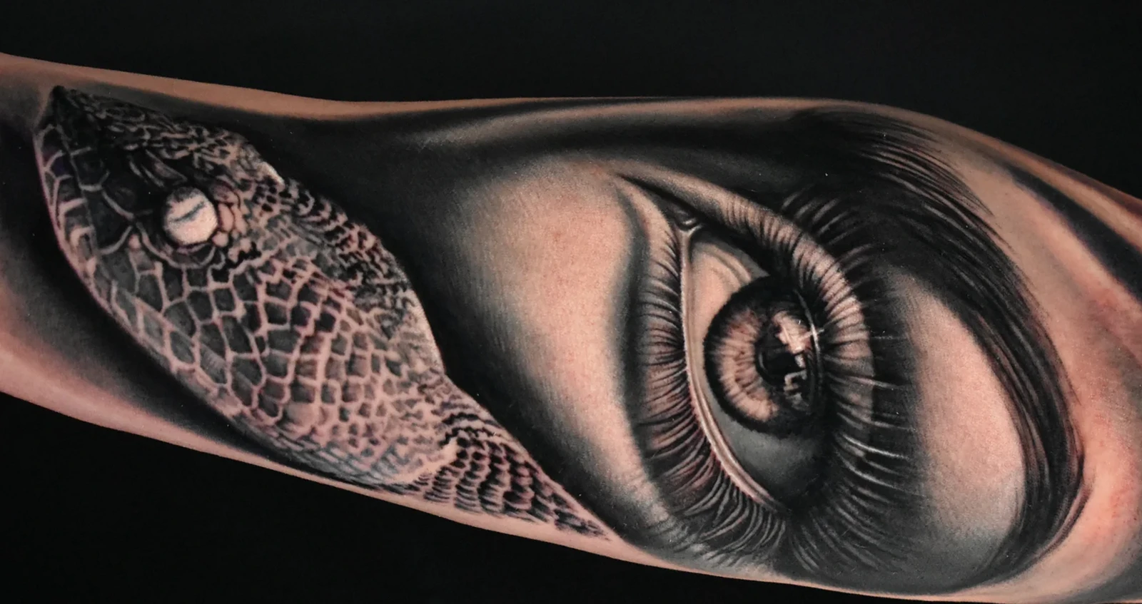 Hyper-realistic black and grey eye tattoo by Giuseppe Bonelli